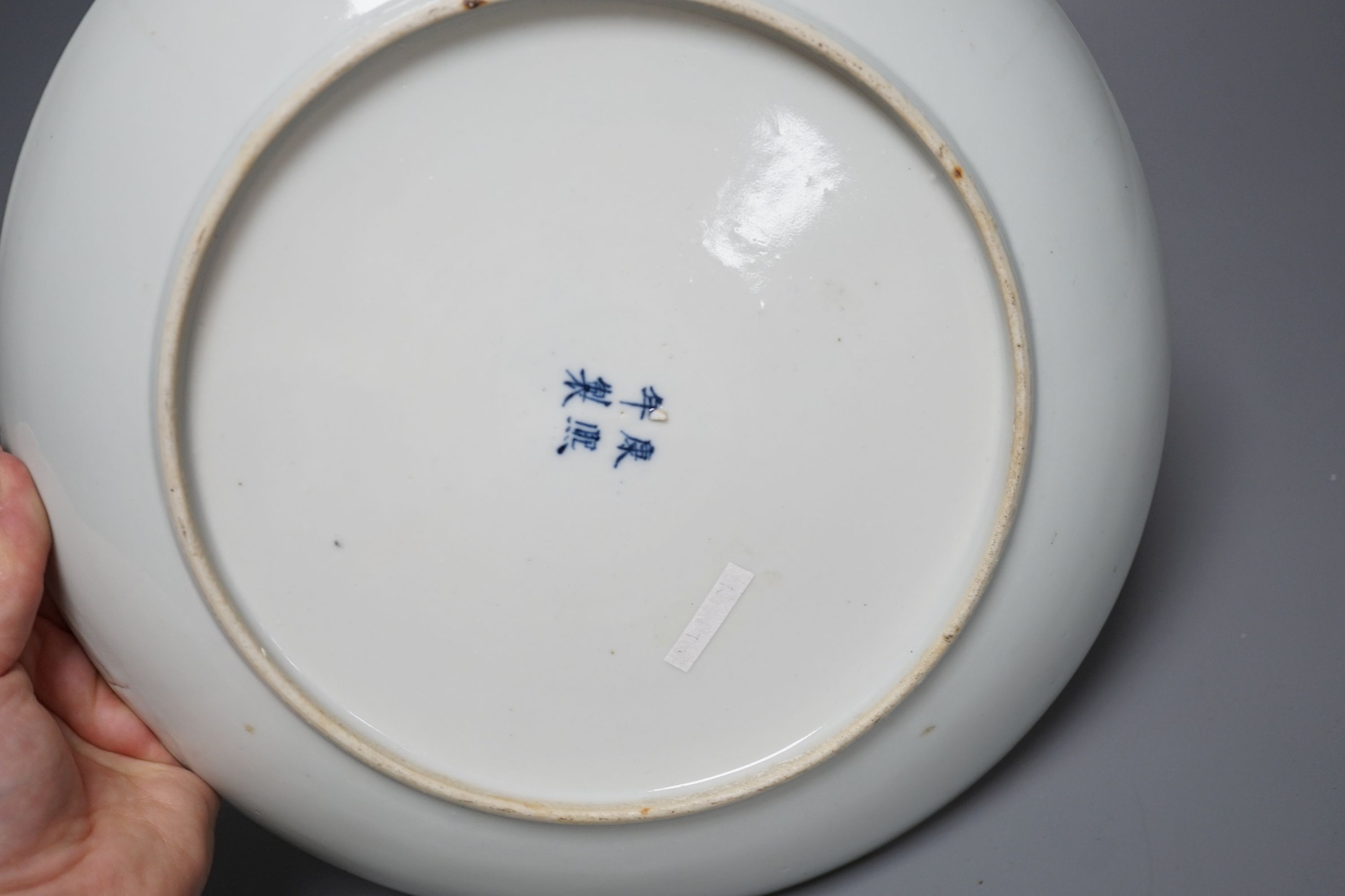 A pair of Chinese blue and white ‘dragon’ dishes, Qing dynasty, 27cm diameter
